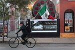 A cyclist rides along the streets of Chicago's Pilsen neighborhood, a predominantly Hispanic area that's experiencing dramatic changes.