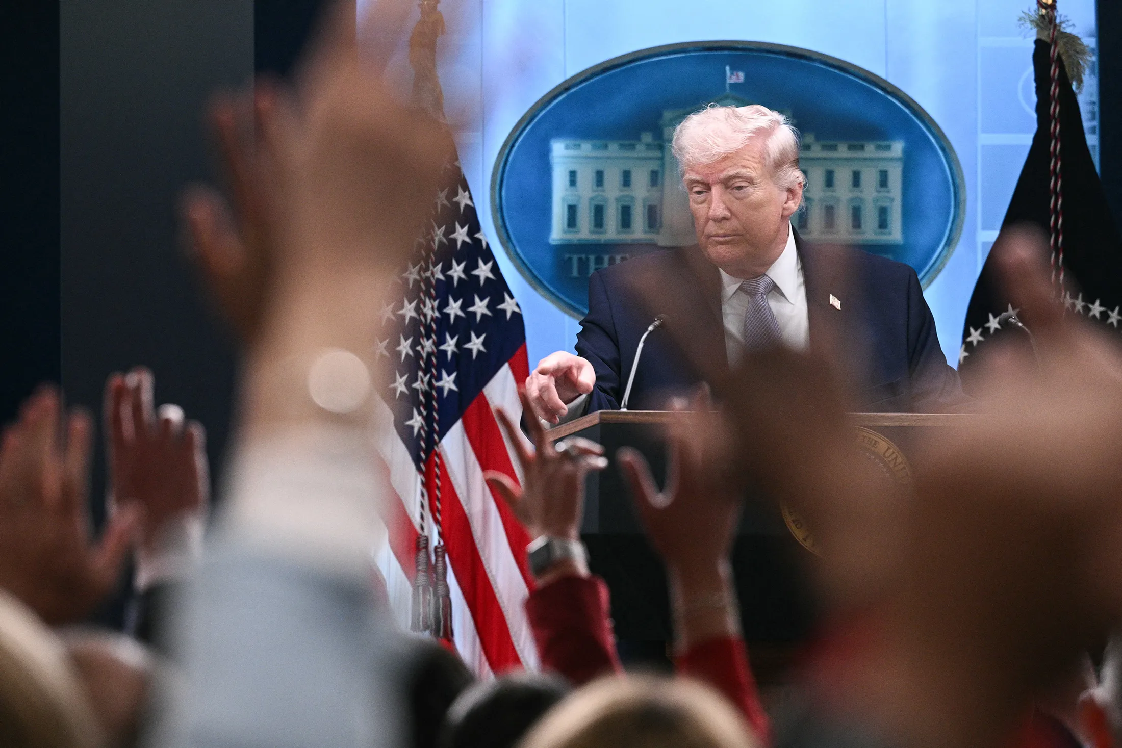Trump takes questions in the White House on Monday.