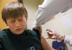 A boy gets a flu shot at a health center in Decatur, Georgia, in February 2018.
