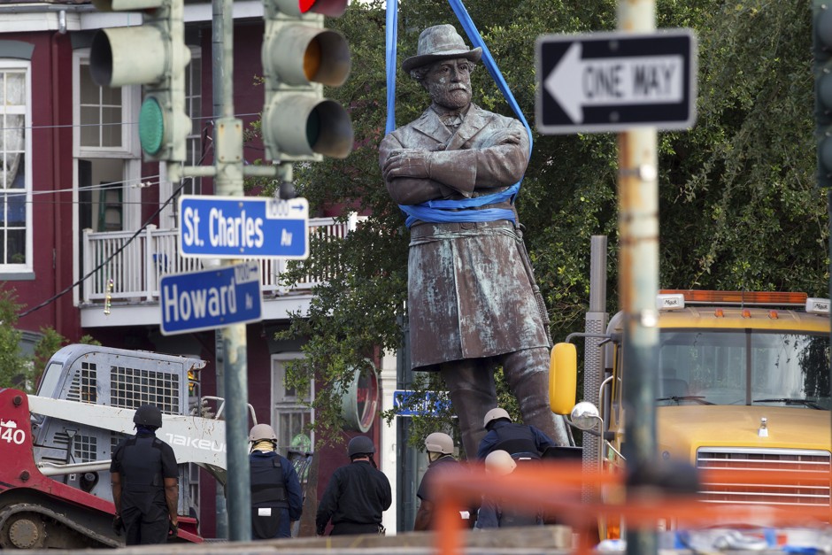 A statue of Confederate General Robert E. Lee is lowered to a truck for removal Friday, May 19, 2017, from Lee Circle in New Orleans. 