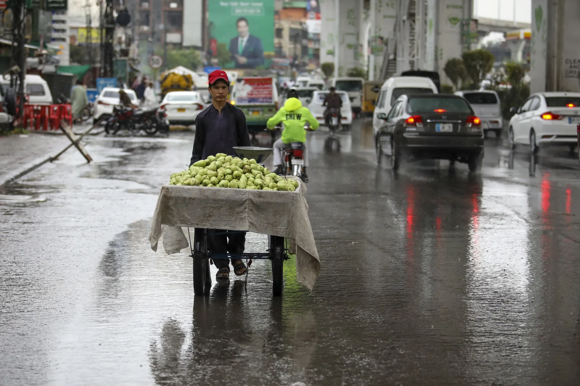 A fruit vendor on the flooded street in Rawalpindi, Pakistan.
