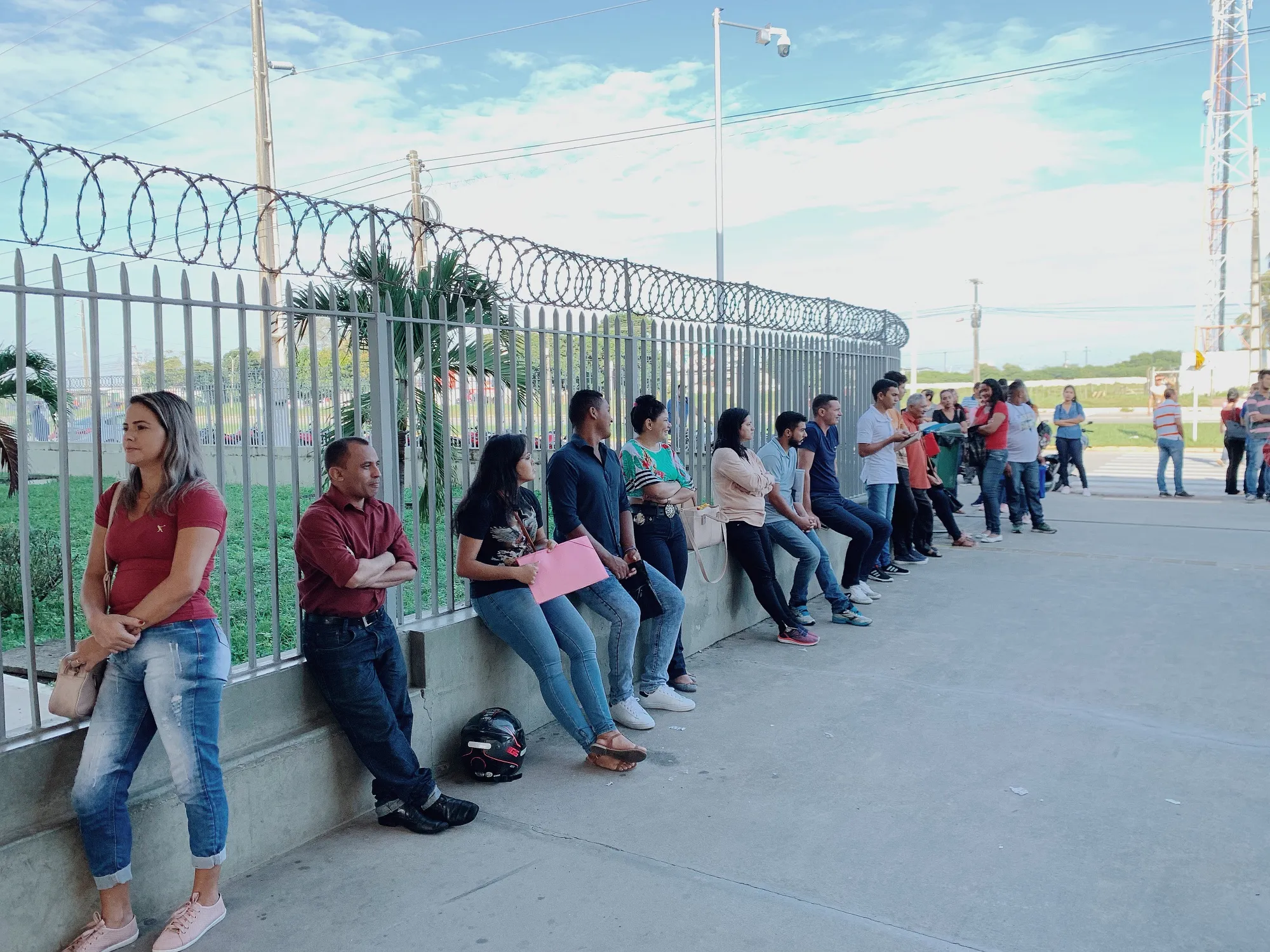 Jobseekers stand in line outside a textile factory in Natal, Rio Grande do Norte, Brazil.