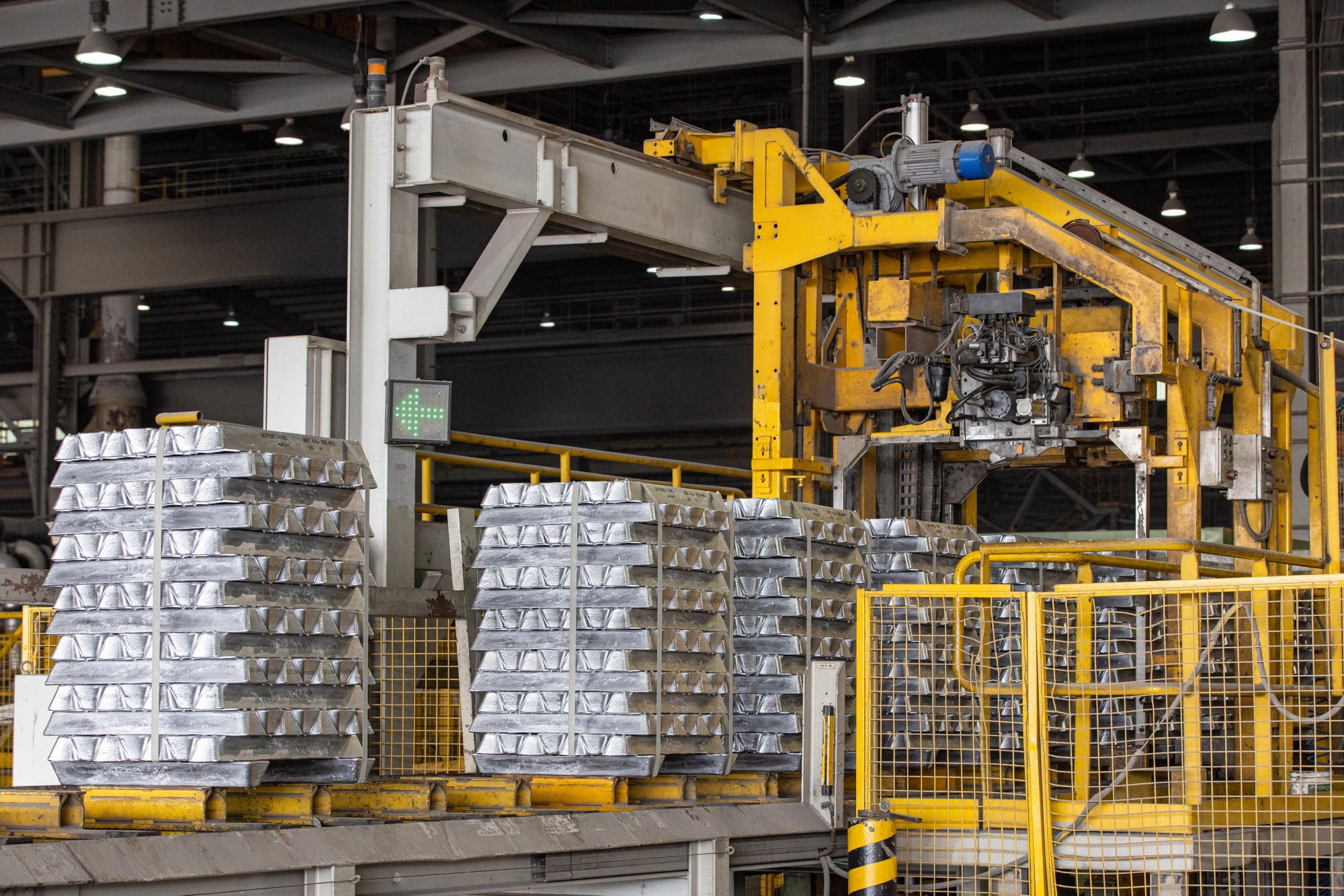 Bound stacked aluminium ingots on a conveyor at the cast house of Emirates Global Aluminium PJSC Al Taweelah plant in Abu Dhabi, United Arab Emirates, on Monday, June 27, 2022. Emirates Global Aluminium and GE Gas Power have signed an agreement to upgrade four gas turbines at the Al Taweelah power plant, to help reduce gas emissions. Photographer: Christopher Pike/Bloomberg