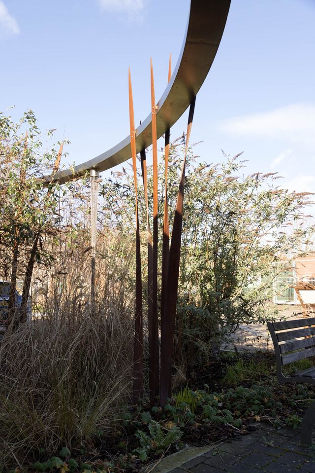 Sculptural gutters that redirect rainwater away from buildings in Bridget Joyce Square. 