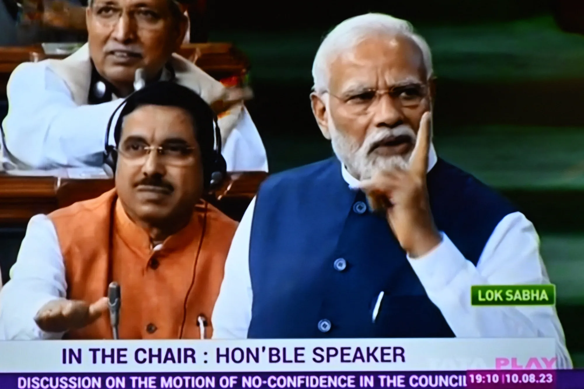 Narendra Modi on a television screen as he addresses the lower house Lok Sabha in New Delhi on Aug. 10.
