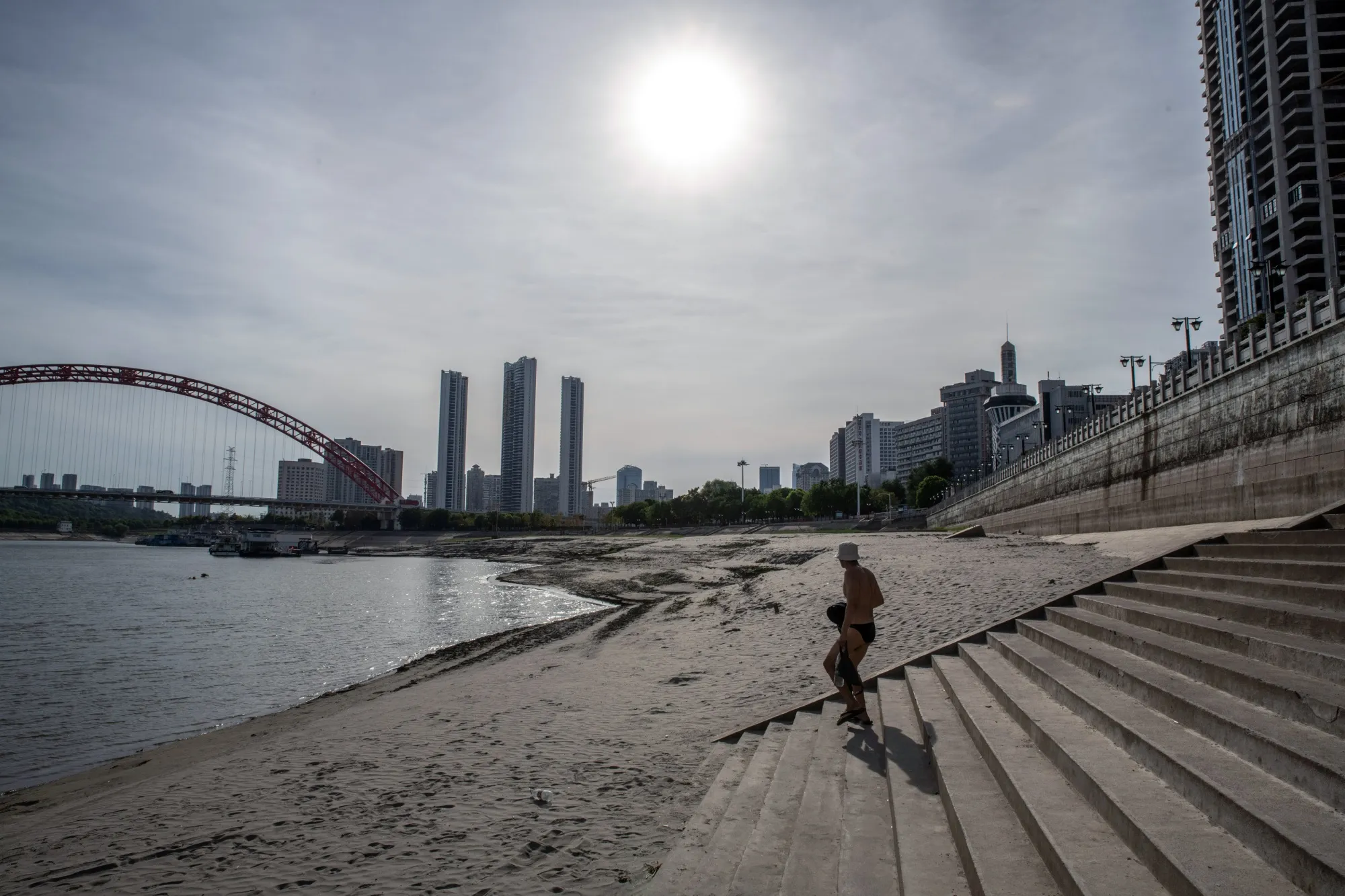 Exposed banks, due to low water levels caused by drought, along the Han River near the confluence with the Yangtze River in Wuhan, China, on Aug. 22, 2022.&nbsp;