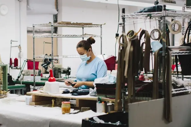 An employee of Rebecca Minkoff handbags at the Baikal manufacturing facility in New York