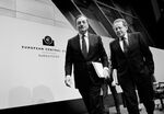 Mario Draghi, left, President of the European Central Bank and vice president Vitor Constancio, right, leave the first press conference following the monthly ECB board meeting in the new ECB headquarters on Dec. 4, 2014 in Frankfurt am Main, Germany.

