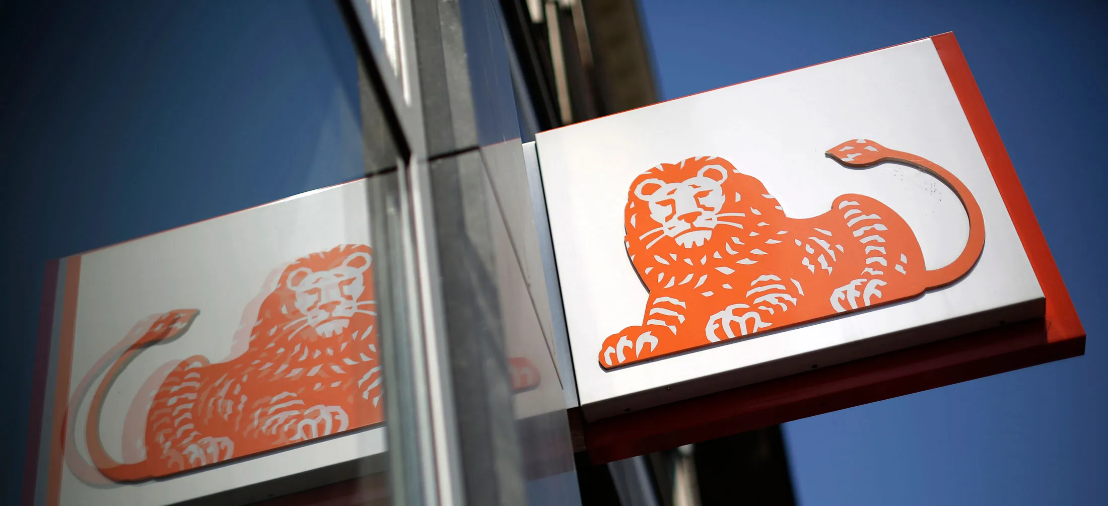 A logos sits on display an ING Groep NV bank branch in Amsterdam, Netherlands, on Tuesday, July 23, 2013. Dutch pension funds will be allowed to calculate liabilities on the basis of an adjusted discount rate as the government seeks to keep the retirement system viable amid low interest rates and an aging population.
