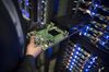 An employee removes a printed circuit board (CPU) from a server rack at Facebook Inc.'s new data storage center near the Arctic Circle in Lulea, Sweden, on Wednesday, June 12, 2013. The data center is Facebook's first outside the U.S., poised to handle all data processing from Europe, Middle East and Africa and the server hub is largest of its kind in Europe, and most northerly of its magnitude anywhere on earth.
