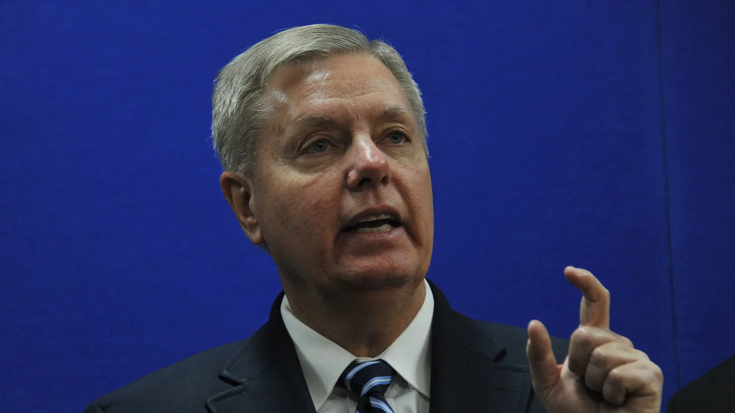 US Senator Lindsey Graham speaks as he takes part in a press conference with unseen US Senator John McCain at the US Embassy in Kabul on January 2, 2014.
