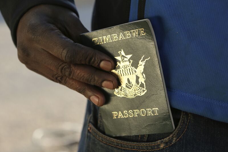 A man queues to submit an application for a new passport in Harare.