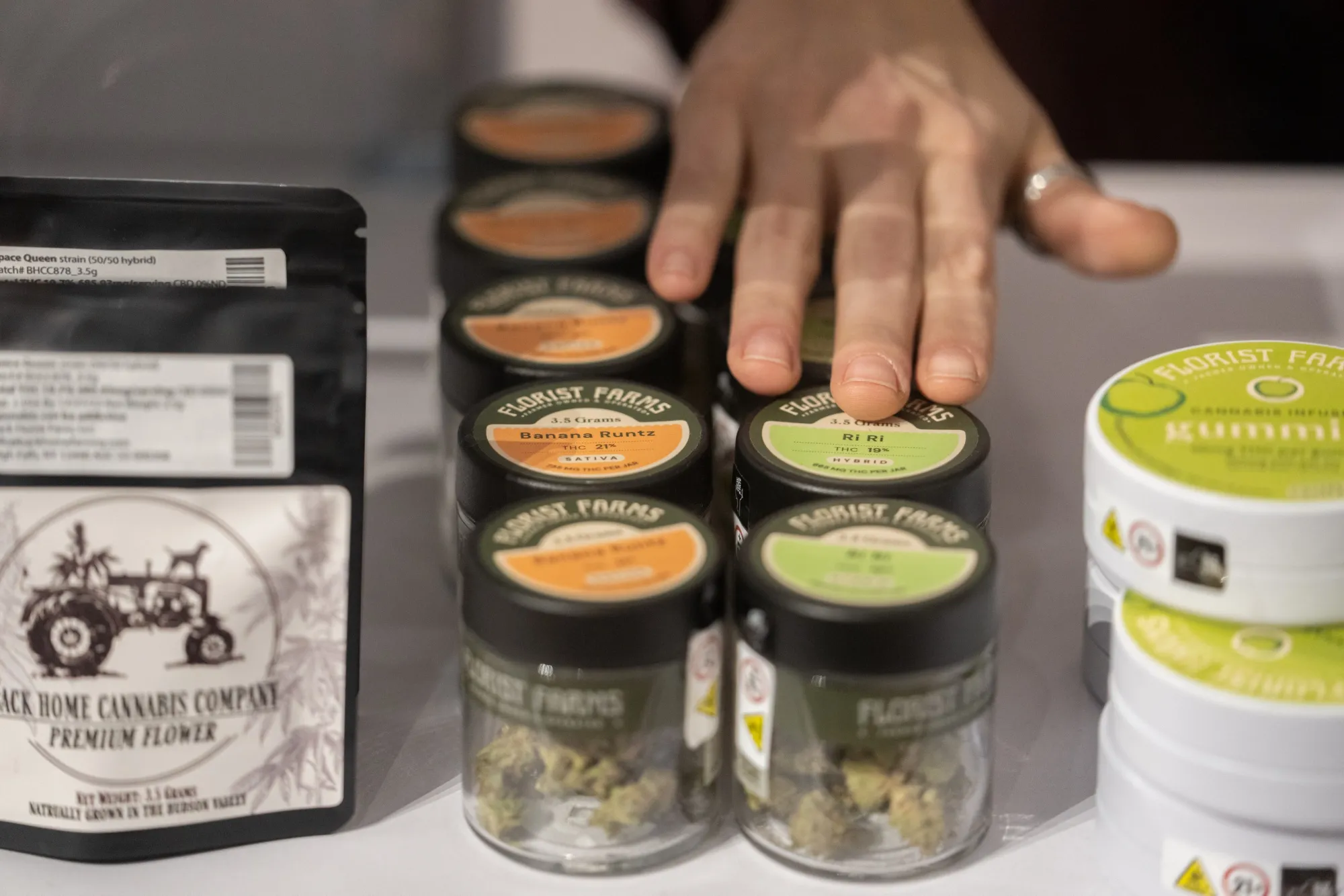 A worker sets up cannabis products on the first day of legal recreational marijuana sales&nbsp;in New York, on Dec. 29, 2022.
