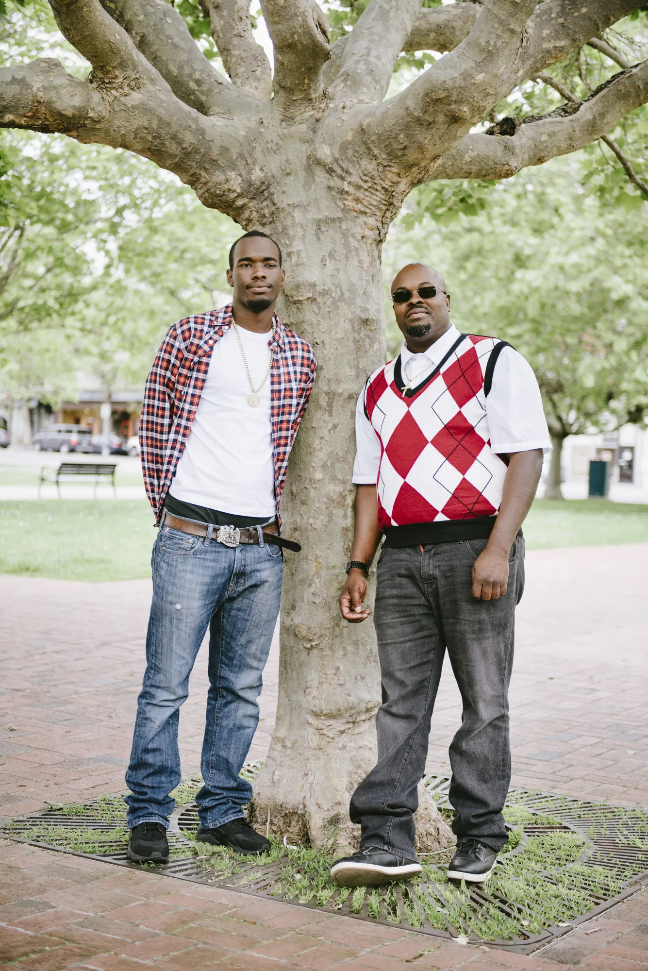 Contract workers Owen Diaz, right, and his son, Demetric, shown in Oakland, California, in 2018. 