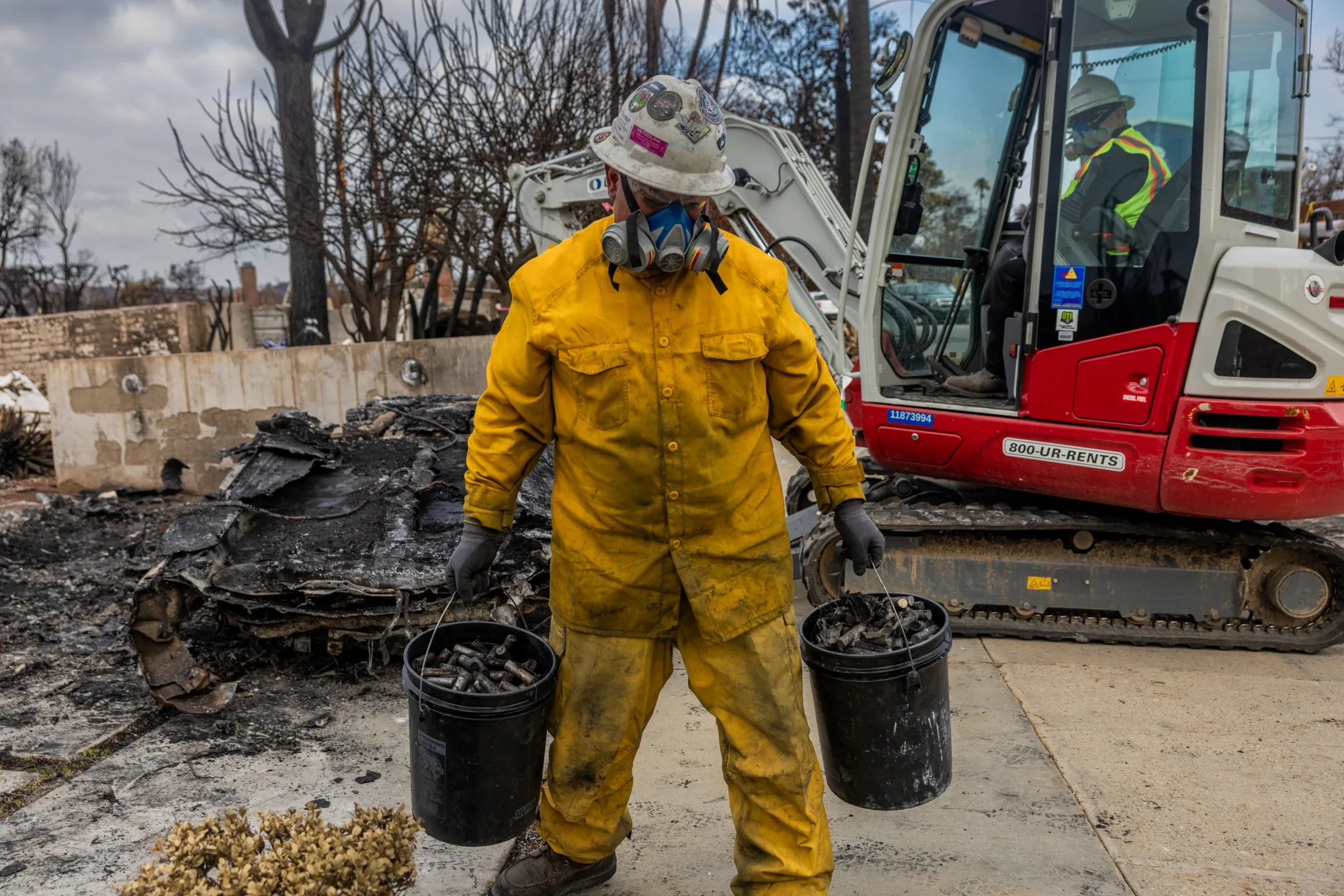 A worker with the US Environmental Protection Agency cleaning up after the&nbsp;Palisades Fire in Los Angeles.