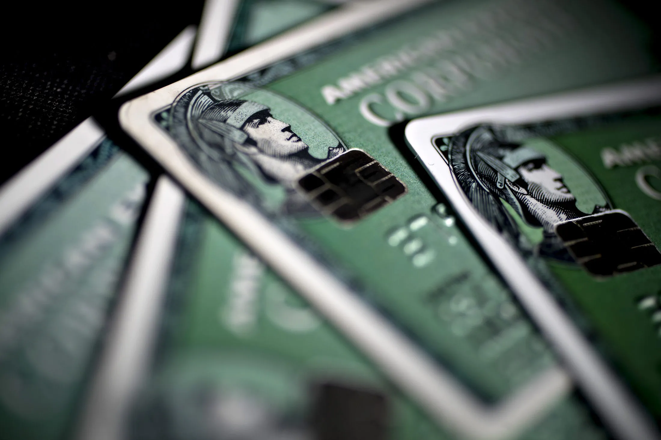 American Express Co. chip credit cards are arranged for a photograph in Washington, D.C., U.S., on Monday, Oct. 24, 2016. American Express surged the most in more than seven years after posting third-quarter profit that beat analysts' estimates and raising its full-year profit forecast.
