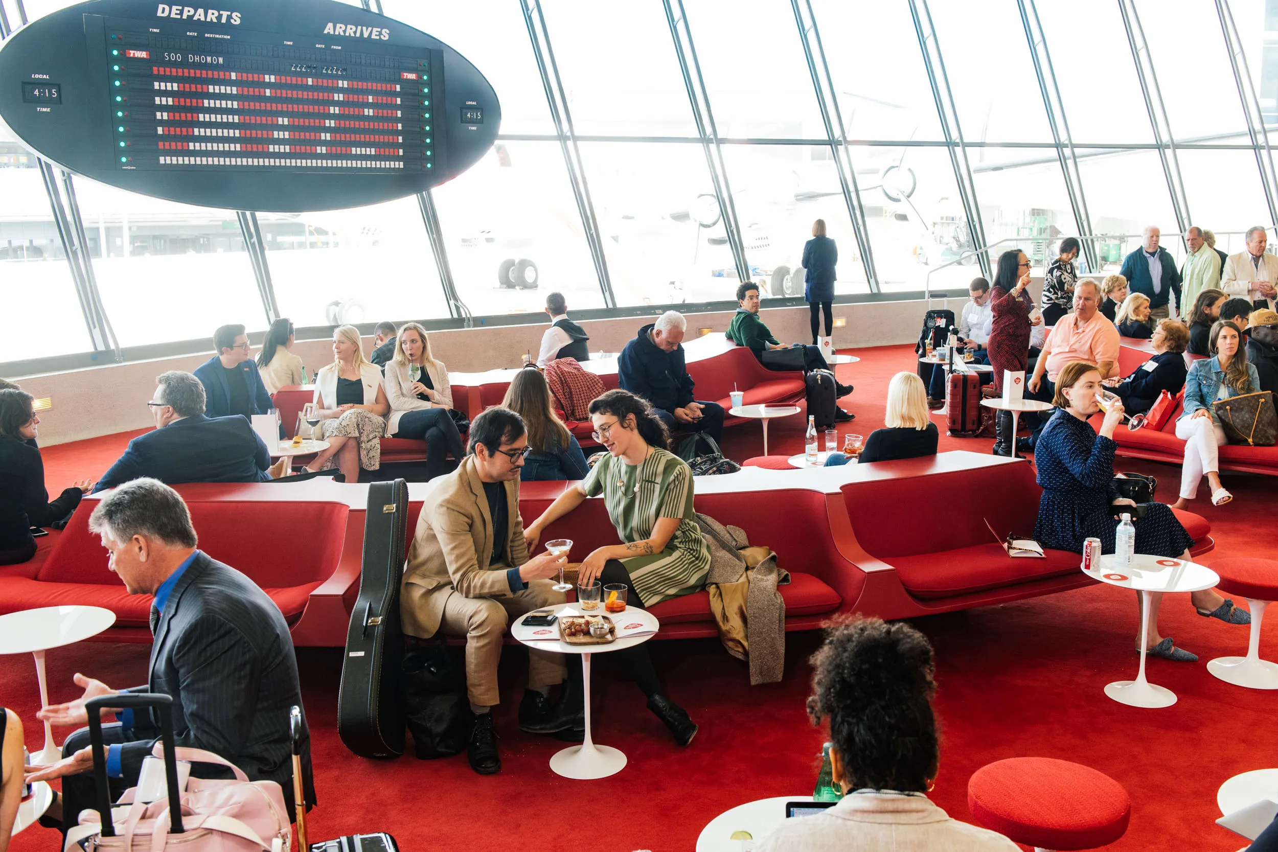 Guests enjoy cocktails in the Sunken Lounge on the TWA Hotel’s opening day, May 15, 2019.