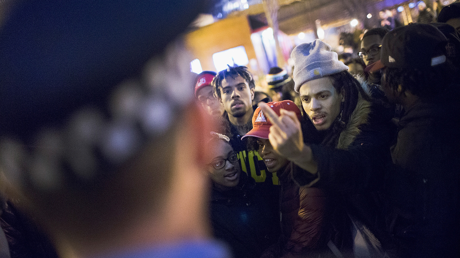 Demonstrators confront police in Chicago following the release of a video on Nov. 24, 2015, showing officer Jason Van Dyke shooting and killing Laquan McDonald.
