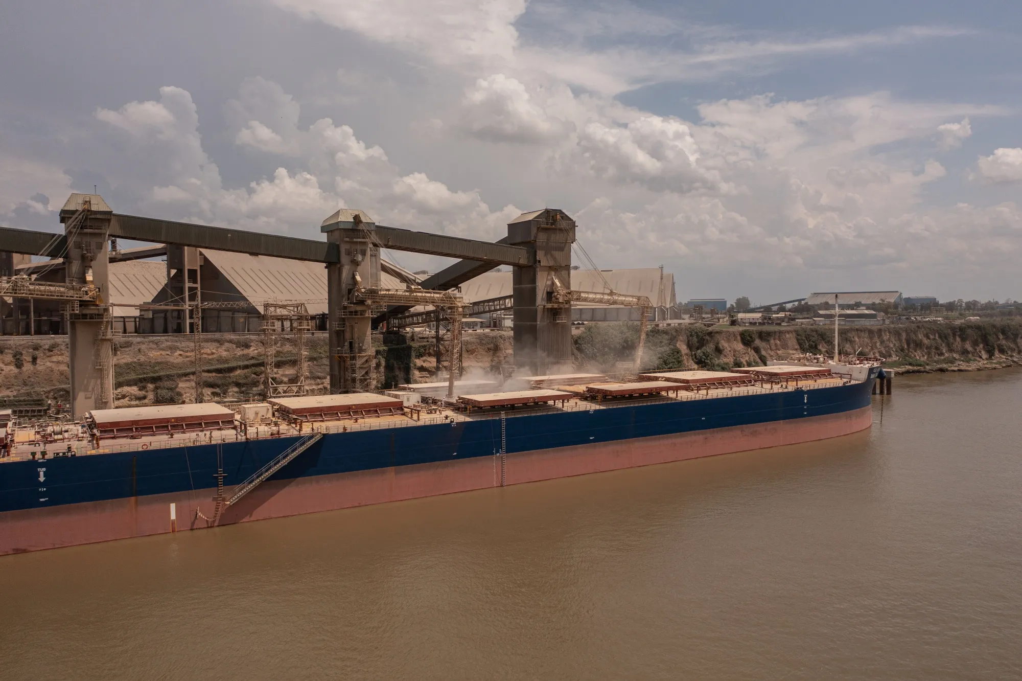 Grains are loaded onto a ship along the Parana River waterway at the Molinos Agro grain processing and crushing facility in Rosario, Santa Fe province, Argentina.