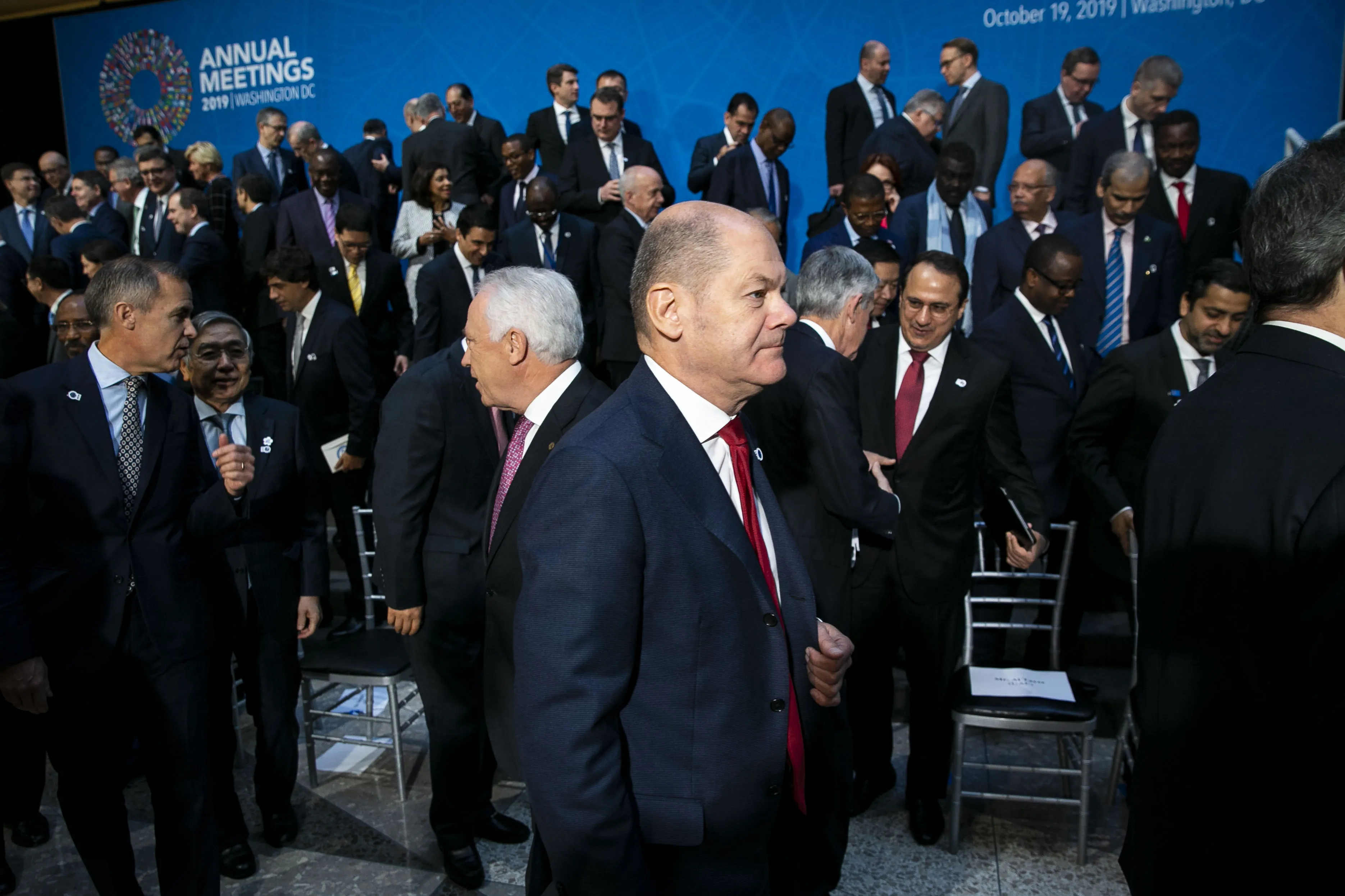Olaf Scholz departs&nbsp;an International Monetary Fund governors group photo at the annual meetings of the IMF and World Bank Group in Washington, D.C., on Oct. 19.
