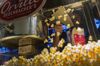 A worker scoops popcorn at a concession stand inside a Cinemark Holdings Inc. movie theater in the Playa Vista neighborhood of Los Angeles, California, U.S.
