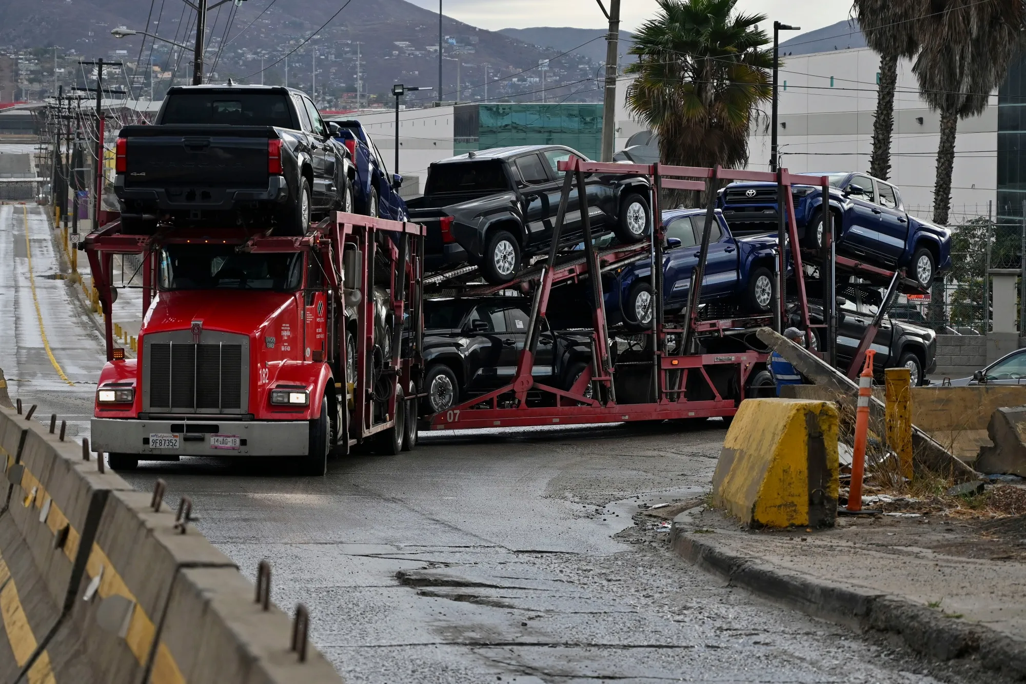 A truck carrying vehicles near the Otay Mesa Port of Entry, on the US-Mexico border in Tijuana, Baja California, Mexico.