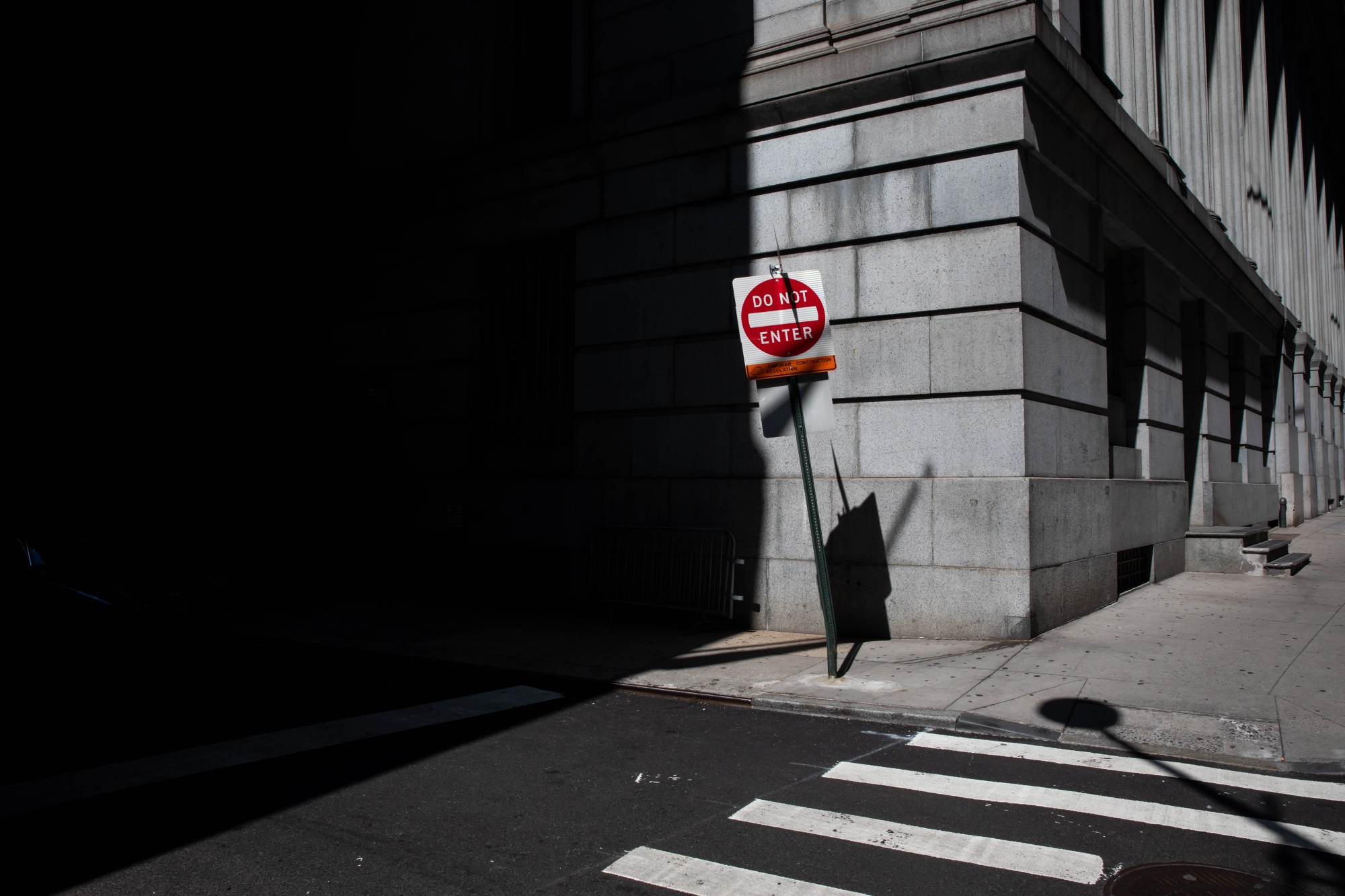 A &quot;Do Not Enter&quot; street sign stands along Wall Street near the New York Stock Exchange (NYSE) in New York, U.S., on Monday, July 20, 2020.&nbsp;