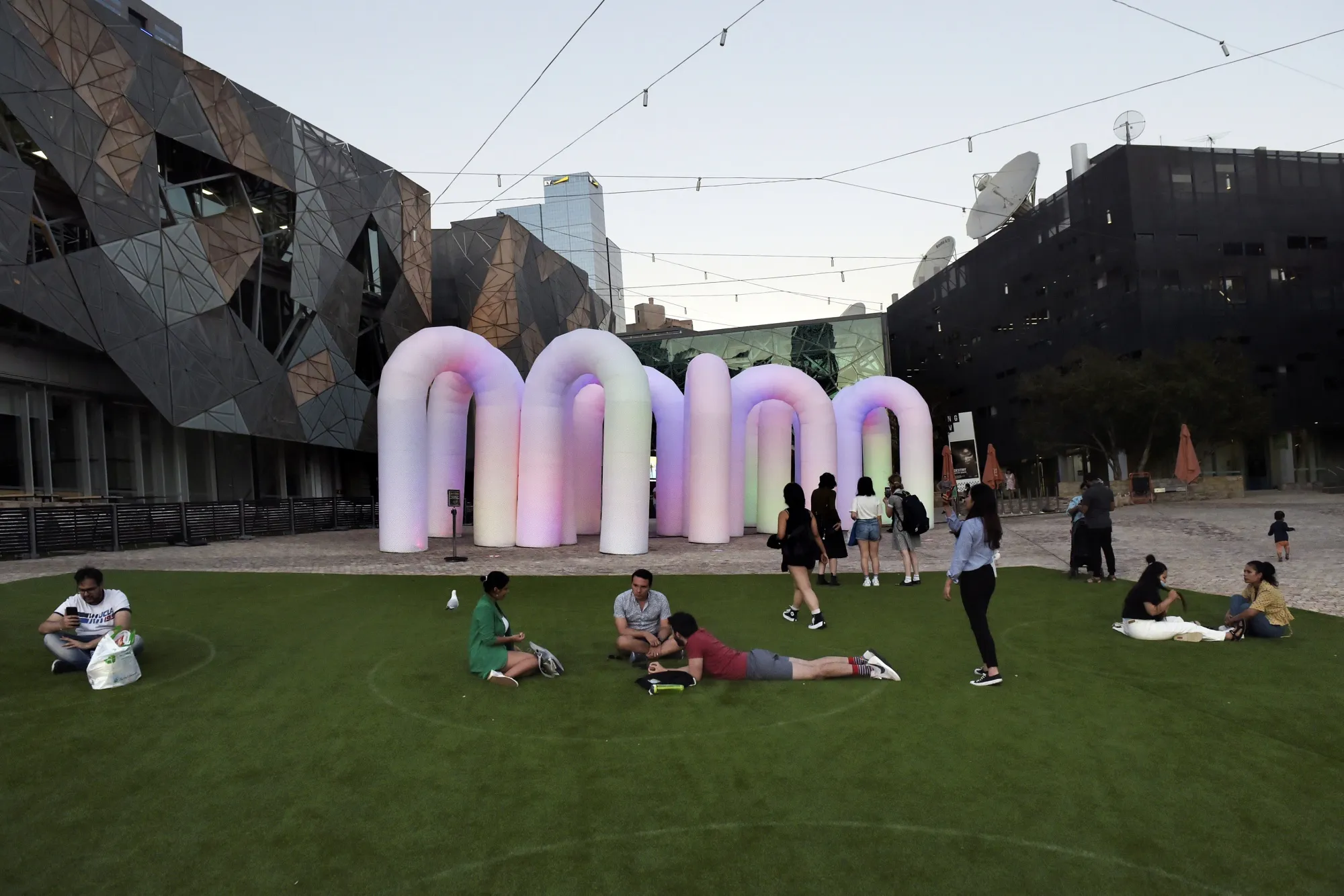 People gather net to the Sky Castle, an interactive installation by designers Eness, at Federation Square in Melbourne, Australia last year.