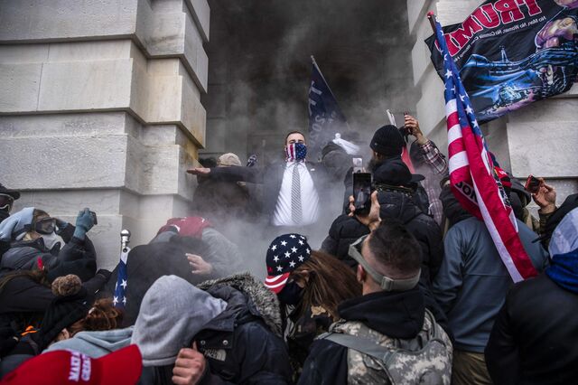 The U.S. Capitol was placed under lockdown as hundreds of protesters stormed the building where lawmakers were debating Joe Biden’s victory. Victor J. Blue/Bloomberg