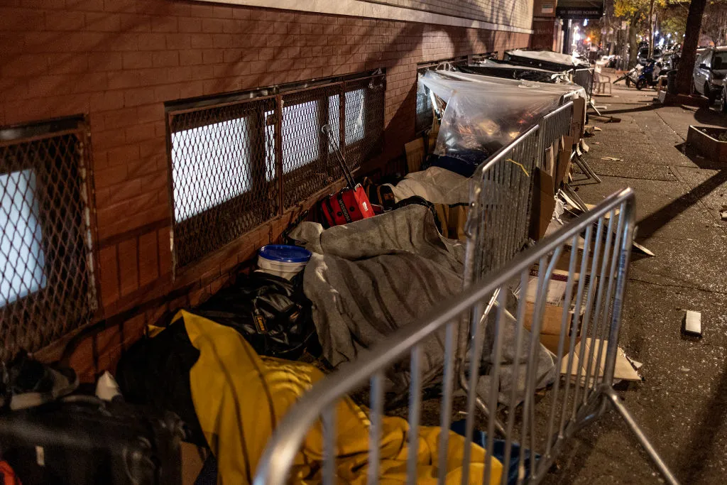 Migrants wait to receive shelter placement in NYC in December 2023.&nbsp;