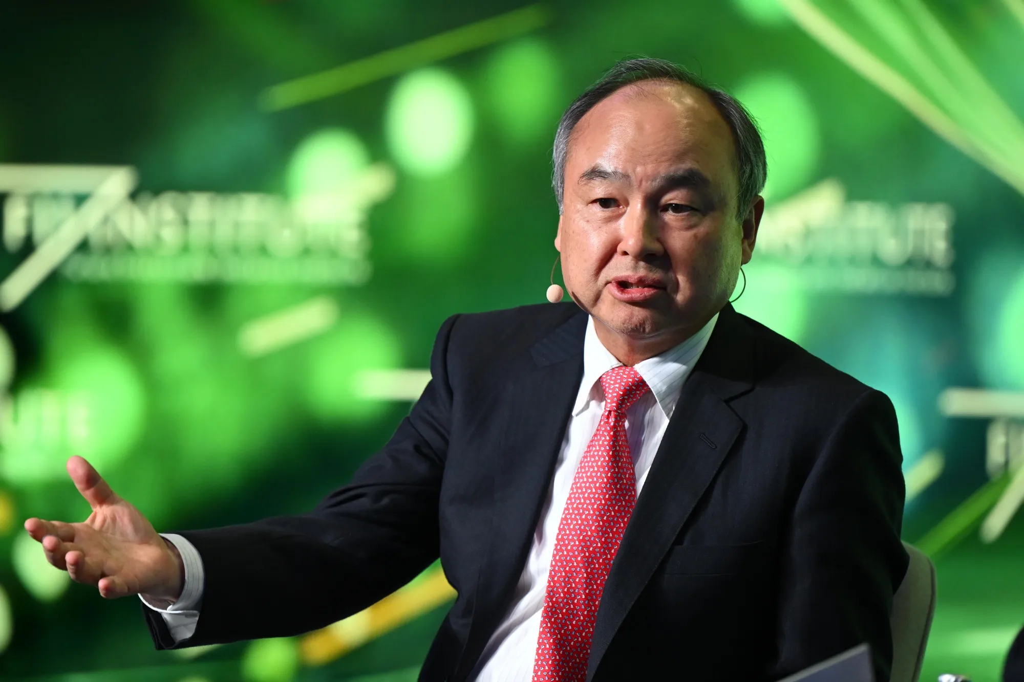 Masayoshi Son, chairman and chief executive officer of SoftBank Group Corp., speaks during the Future Investment Initiative (FII) Institute Priority Asia conference in Tokyo, Japan, on Monday, Dec. 1, 2025. The two-day conference is scheduled to conclude today.
