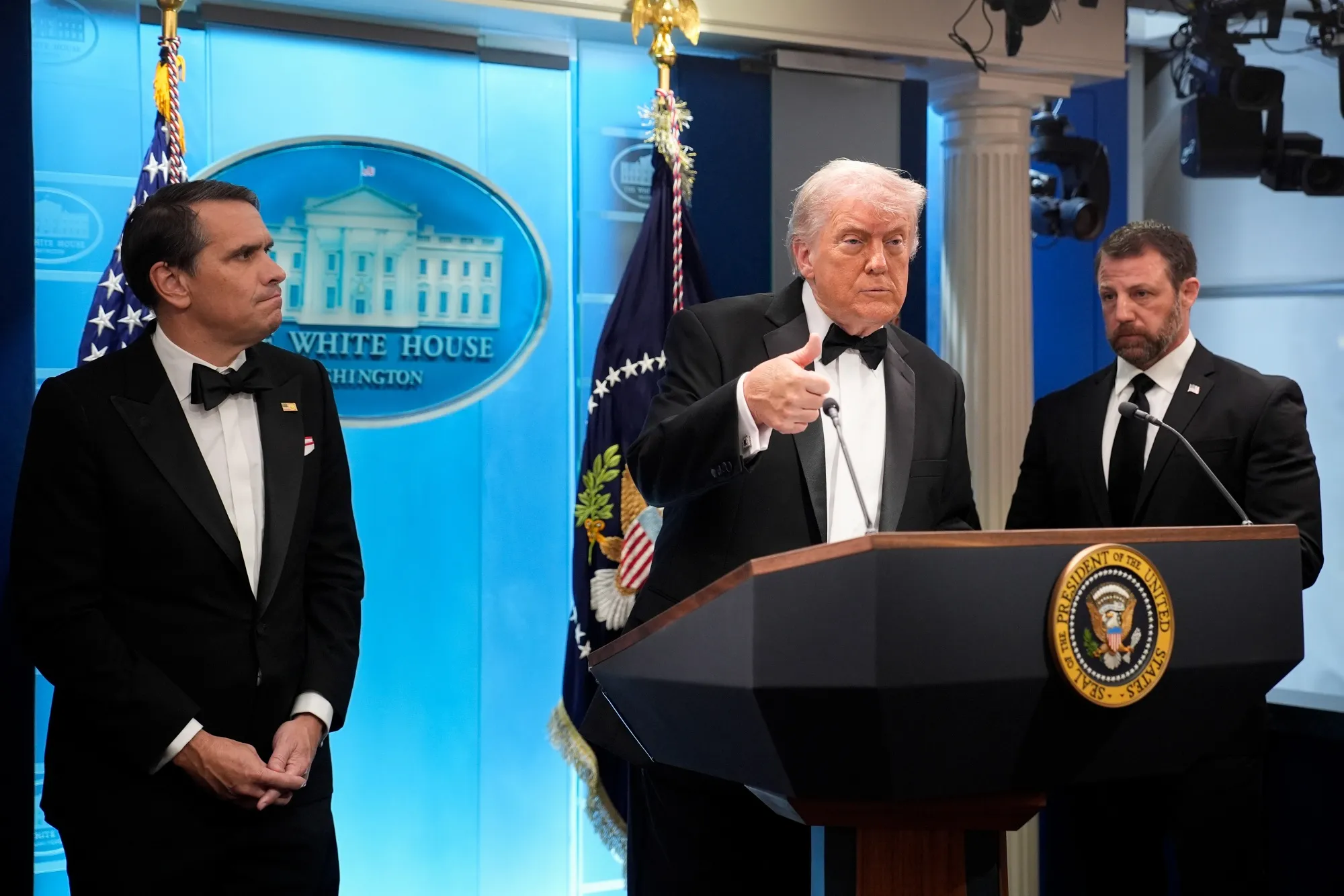 President Donald Trump with Todd Blanche, acting US attorney general, left, and Markwayne Mullin, secretary of the US Department of Homeland Security, right, during a news conference at the White House on Saturday night.