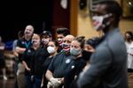 People wearing protective masks listen to instructions at a Catholic Charities Brooklyn and Queens pop-up food pantry in the Brooklyn borough of New York, U.S., on May 29.