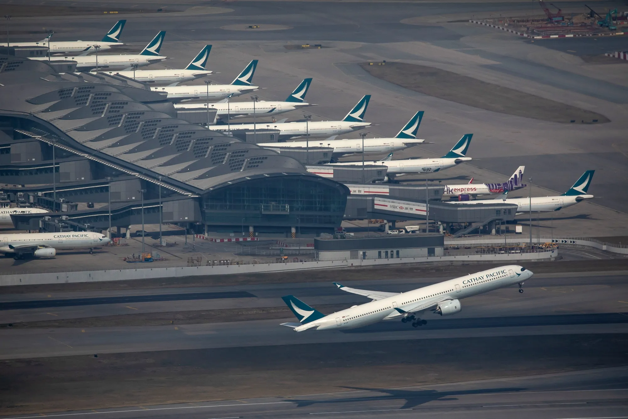 An aircraft operated by Cathay Pacific Airways Ltd. takes off from the Hong Kong International Airport in Hong Kong, China.
