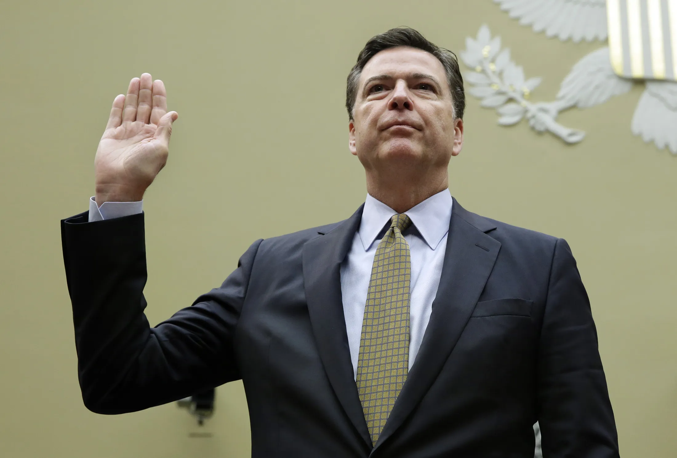 James Comey is sworn-in before a hearing on July 7. Photographer: Yuri Gripas/AFP via Getty Images
