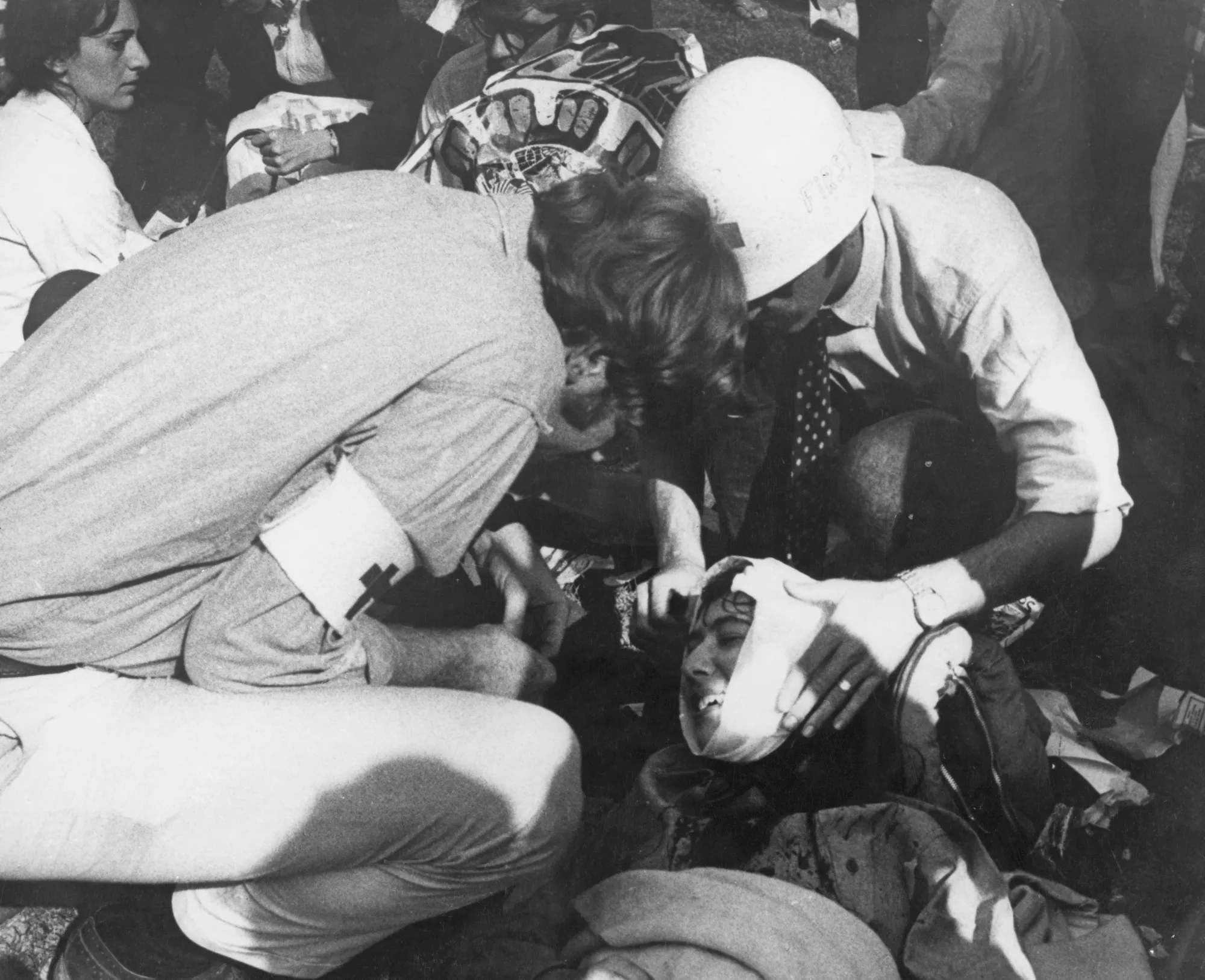 A medic wraps a bandage around the head of an injured protester during the violent clashes at the 1968 Democratic convention, held in Chicago