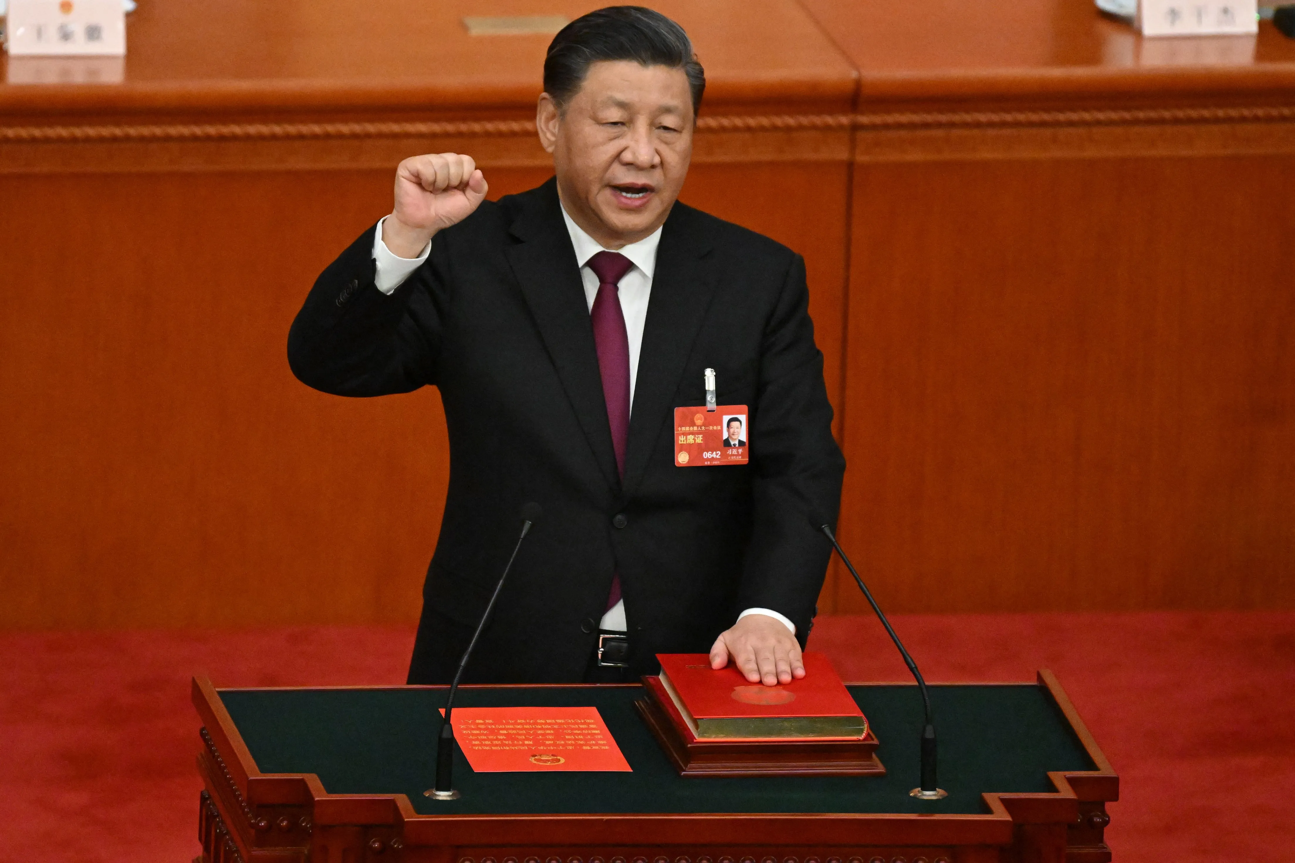 Xi Jinping swears under oath after being re-elected as president for a third term in Beijing on March 10.