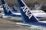 All Nippon Airways Co. (ANA) aircraft stand parked at Haneda Airport in Tokyo, Japan, on Wednesday, April 26, 2017. ANA is scheduled to release Fourth-quarter earnings figures on April 28.
