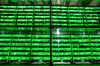 Illuminated mining rigs operate mounted inside racks at the BitRiver Rus LLC cryptocurrency mining farm in Bratsk, Russia, on Friday, Nov. 8, 2019. Bitriver, the largest data center in the former Soviet Union, was opened just a year ago, but has already won clients from all over the world, including the U.S., Japan and China. Most of them mine bitcoins.