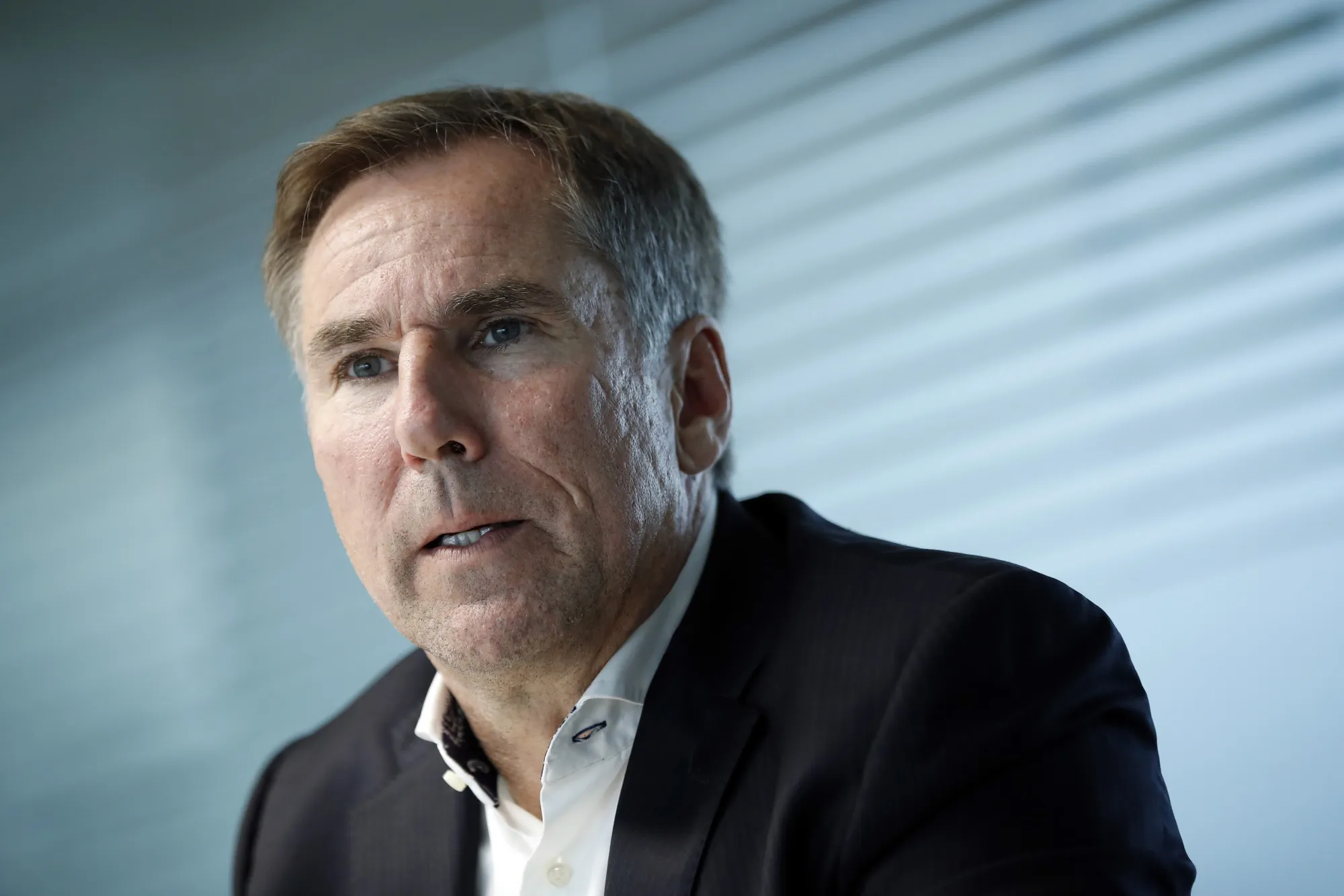 Jan Jenisch speaks during an interview in Zug.