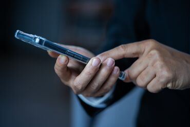 Close up of man using smart phone,Stock trading