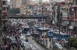 People and vehicles crowd the market of Al Ataba in Cairo, on May 18.