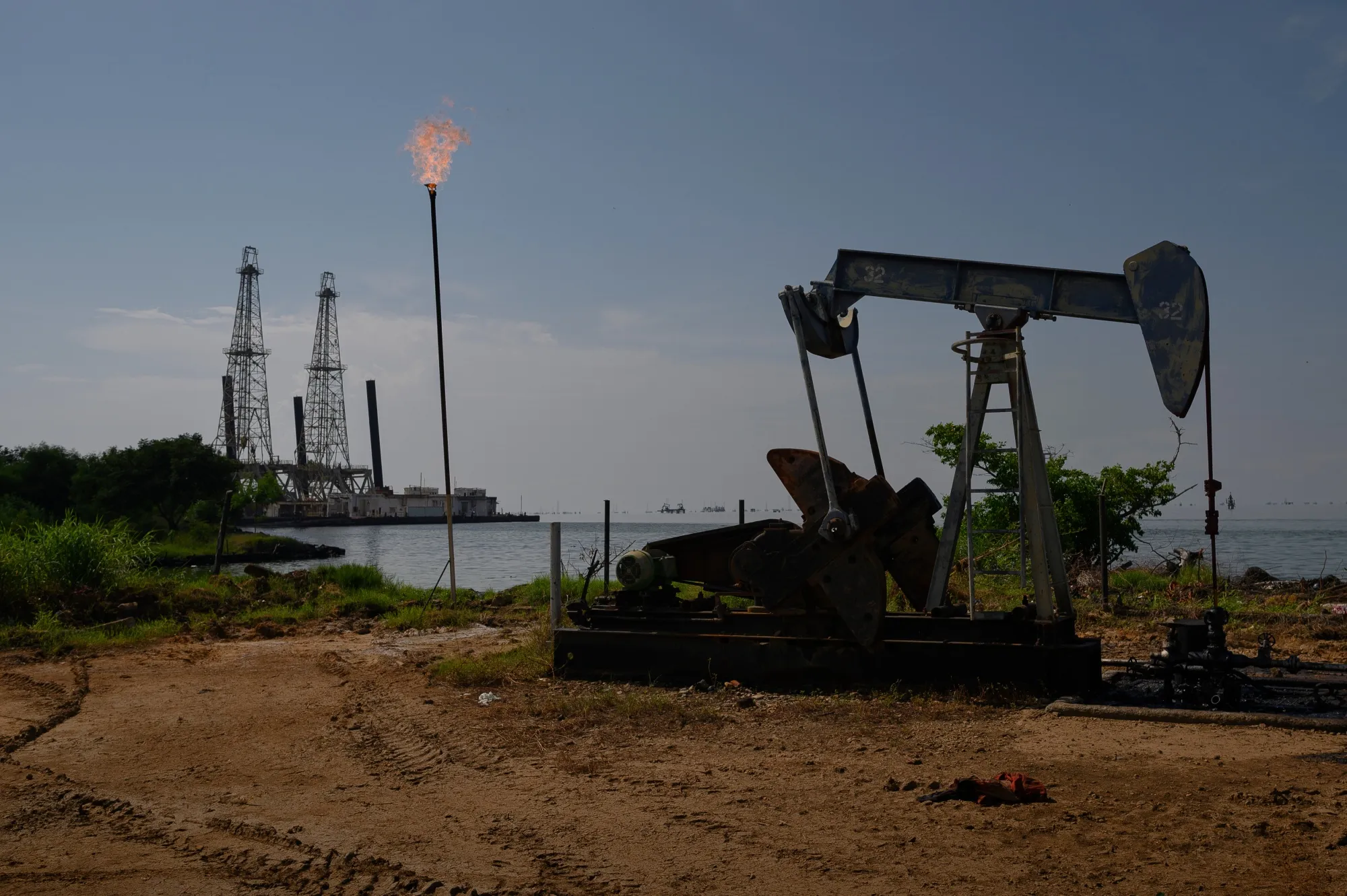A Petroleos de Venezuela SA (PDVSA) oil pumpjack on Lake Maracaibo in Cabimas, Zulia state, Venezuela.