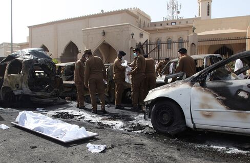 Saudi security forces inspect the site of a suicide bombing that targeted the Shiite Al-Anoud mosque in Dammam on May 29, 2015. Source: AFP/Getty Images