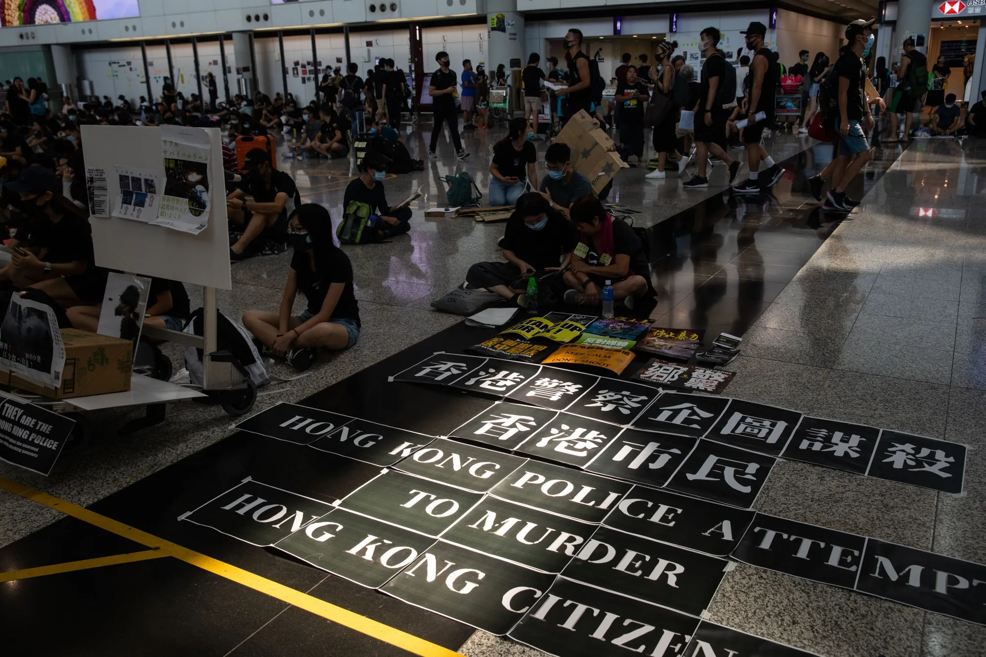 Protesters stage a sit-in at the Hong Kong International Airport on Aug. 13.