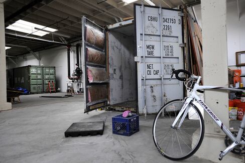 Shipping containers being converted into living spaces in an East Bay warehouse. Photographer: Michael Short/Bloomberg
