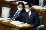 Fumio Kishida, right, with Yoshimasa Hayashi, Japan’s foreign minister, at the lower house of parliament on Dec. 6.