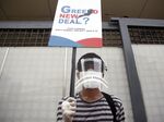 A climate protester outside the South Korean Embassy in Jakarta, on June 25