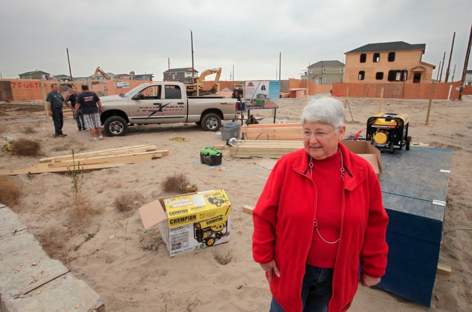 Marie Lopresti visits the site of her former house in Breezy Point, Thursday, Oct. 17, 2013 in the Queens borough of New York. A year before, on October 29, Superstorm Sandy sparked a fire in the neighborhood burning Lopresti's home and more than 100 others.
