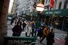 Pedestrians walk along Broadway near the New York Stock Exchange (NYSE) in New York, U.S., on Monday, Jan. 14, 2019. U.S. stocks declined as weak Chinese trade data spurred concerns about slowing global growth.